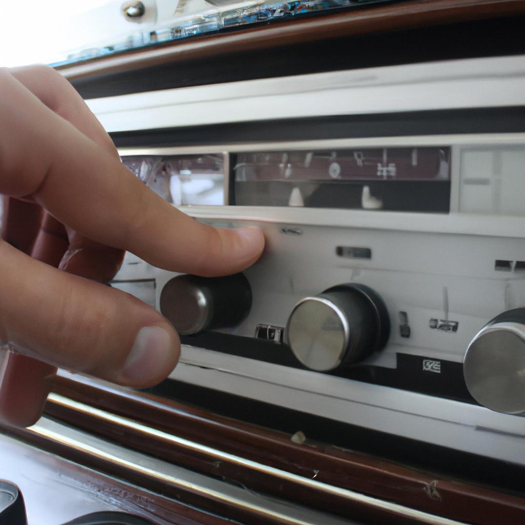 Person adjusting knobs on radio